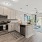 kitchen and living area with an island and bright, natural lighting