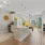 kitchen and dining room with modern appliances and bright lighting